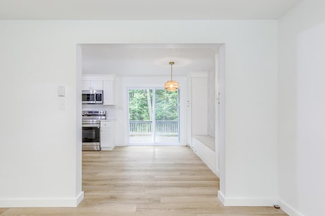 70 Whitten Rd, Kennebunk, ME 04043 - corridor with light wood-style flooring and baseboards