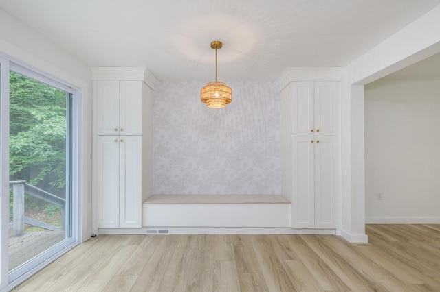 70 Whitten Rd, Kennebunk, ME 04043 - unfurnished dining area with light wood-style floors and wallpapered walls