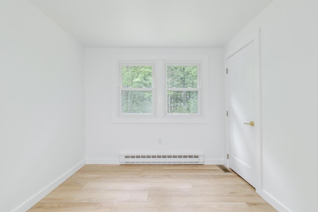 70 Whitten Rd, Kennebunk, ME 04043 - spare room featuring a baseboard heating unit and light wood finished floors