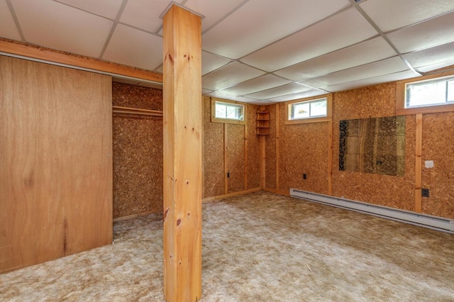 70 Whitten Rd, Kennebunk, ME 04043 - below grade area featuring a baseboard radiator, a drop ceiling, and carpet floors