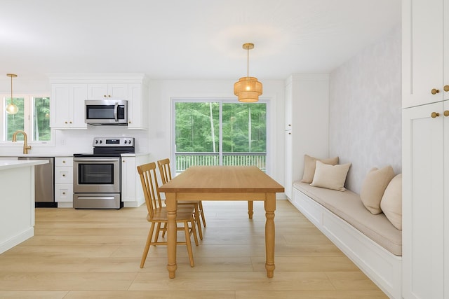 70 Whitten Rd, Kennebunk, ME 04043 - dining space with light wood finished floors