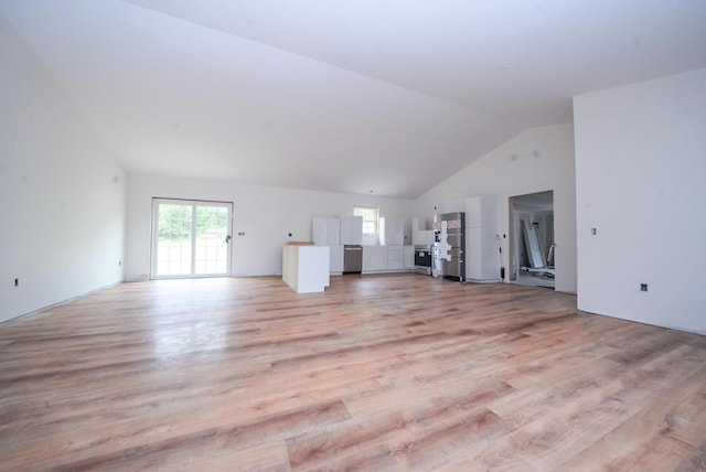 316 Clark Rd, Hermon, ME 04401 - unfurnished living room with healthy amount of natural light, light wood-style flooring, and high vaulted ceiling