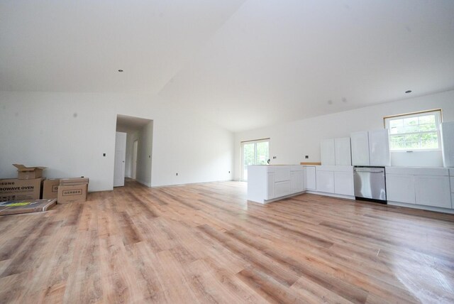 316 Clark Rd, Hermon, ME 04401 - unfurnished living room with light wood-style flooring, plenty of natural light, and high vaulted ceiling
