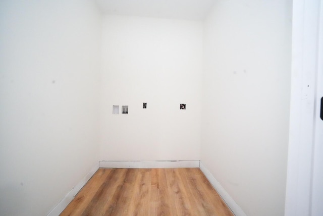 316 Clark Rd, Hermon, ME 04401 - laundry area with light wood-style flooring and baseboards