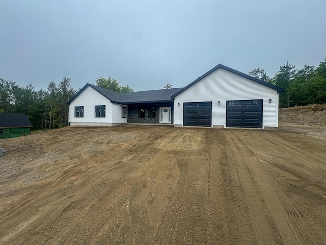 316 Clark Rd, Hermon, ME 04401 - view of front facade with dirt driveway and a garage