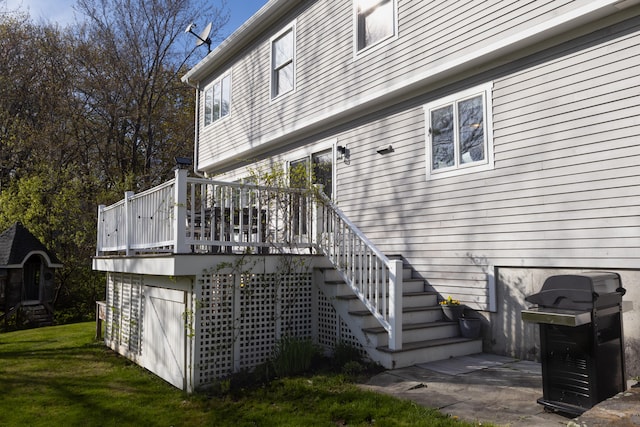 7 Hamlin St, Cape Elizabeth, ME 04107 - rear view of house featuring stairs, a yard, and a deck