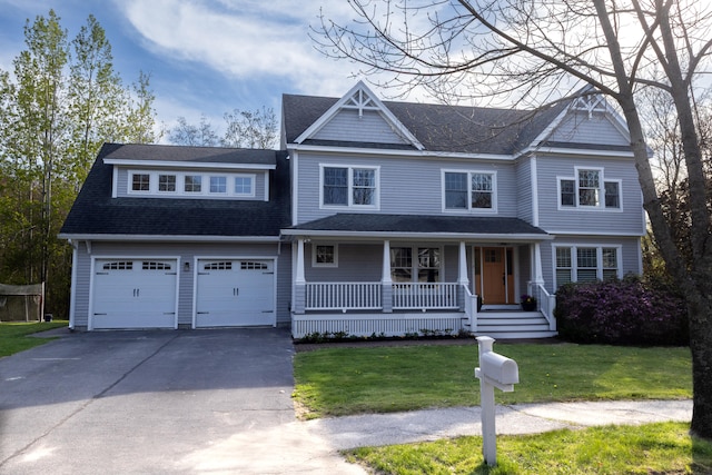7 Hamlin St, Cape Elizabeth, ME 04107 - view of front of property featuring covered porch, driveway, a front lawn, a shingled roof, and a garage