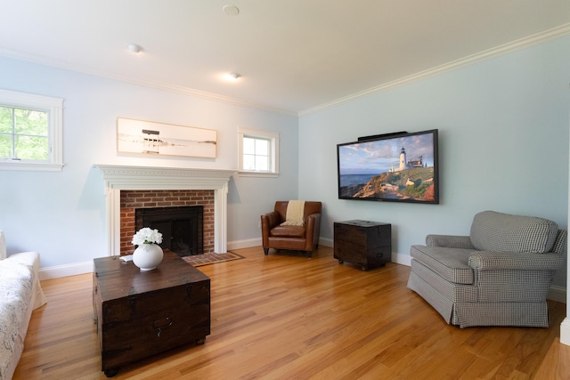 7 Hamlin St, Cape Elizabeth, ME 04107 - living room with light wood-style floors, crown molding, and a fireplace