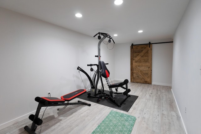 7 Hamlin St, Cape Elizabeth, ME 04107 - workout room with a barn door, wood finished floors, and recessed lighting