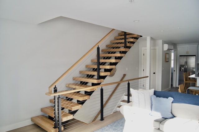 14 Salt Point Dr Unit 19, Old Orchard Beach, ME 04064 - stairway with an AC wall unit, wood finished floors, baseboards, and recessed lighting