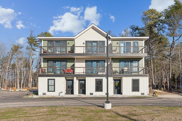14 Salt Point Dr Unit 19, Old Orchard Beach, ME 04064 - rear view of house with a balcony and board and batten siding
