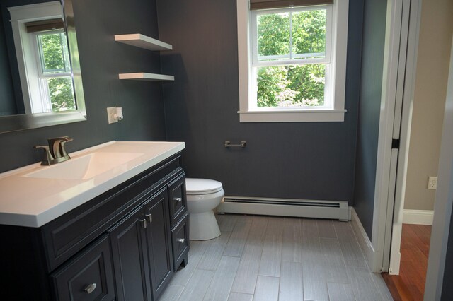33 Webb Rd, Windham, ME 04062 - bathroom with a baseboard radiator, vanity, and plenty of natural light