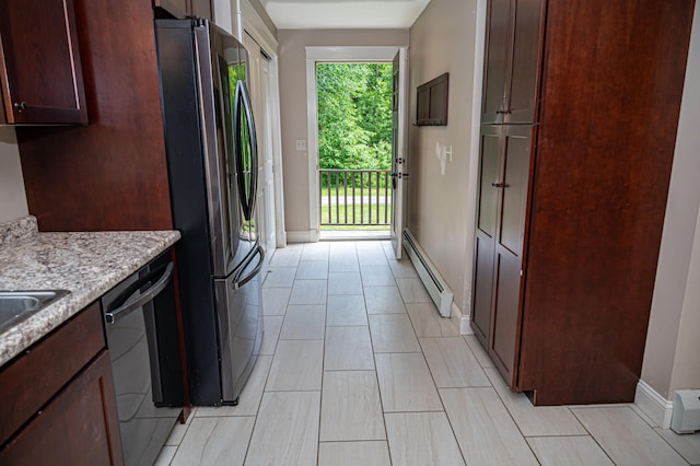 33 Webb Rd, Windham, ME 04062 - kitchen featuring freestanding refrigerator, baseboard heating, dishwashing machine, and light stone countertops