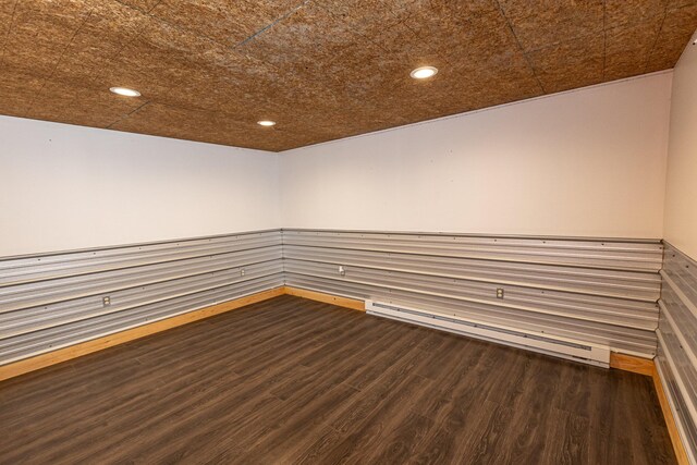 33 Webb Rd, Windham, ME 04062 - empty room featuring a baseboard radiator, wood finished floors, wainscoting, and recessed lighting