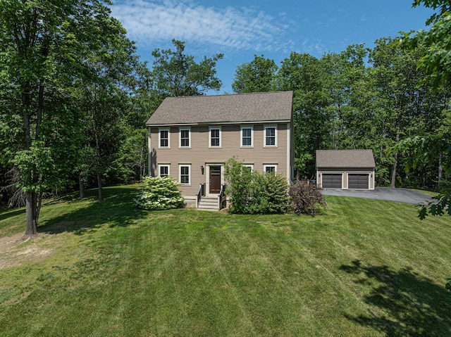 33 Webb Rd, Windham, ME 04062 - colonial home with an outdoor structure, a front lawn, a garage, and asphalt driveway