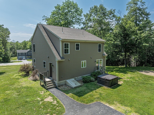 33 Webb Rd, Windham, ME 04062 - back of house with a lawn and roof with shingles