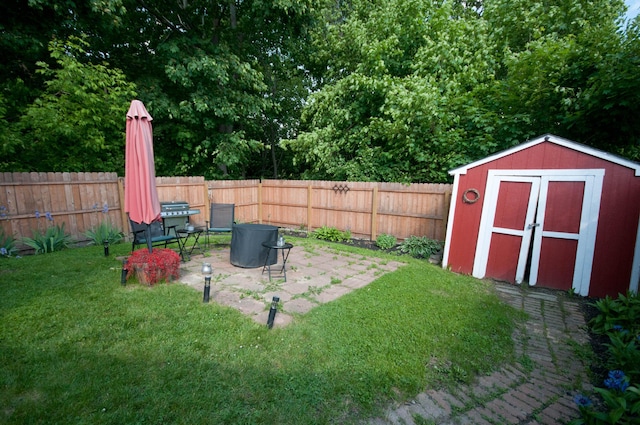 198 3rd St, Bangor, ME 04401 - fenced backyard featuring a storage shed and a patio area