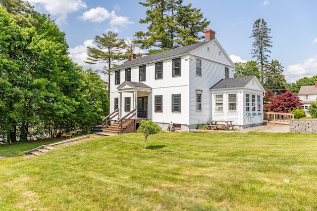 166 Franklin St, Bucksport, ME 04416 - view of front of home with a chimney, a shingled roof, and a front lawn