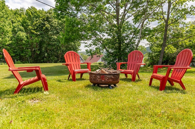 166 Franklin St, Bucksport, ME 04416 - view of grassy yard featuring an outdoor fire pit