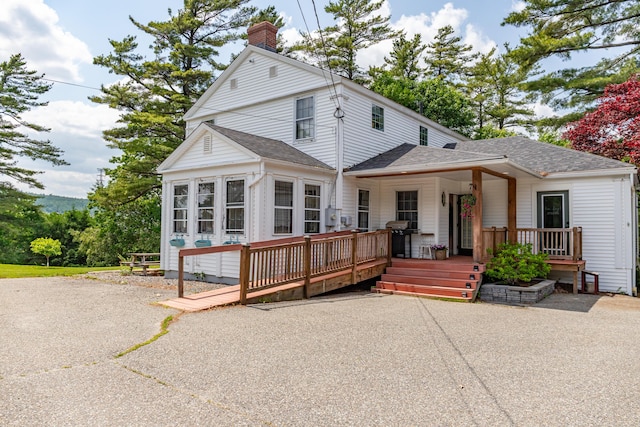 166 Franklin St, Bucksport, ME 04416 - view of front of house with roof with shingles and a chimney
