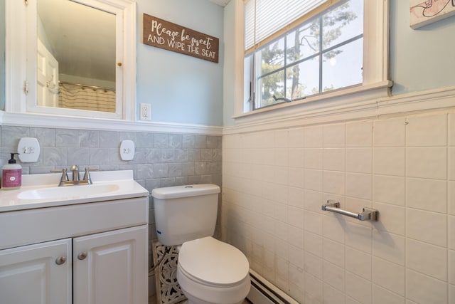 166 Franklin St, Bucksport, ME 04416 - bathroom with vanity, tile walls, and a wainscoted wall