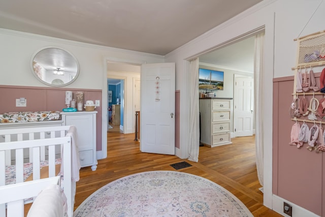 166 Franklin St, Bucksport, ME 04416 - bedroom featuring wood finished floors and ornamental molding