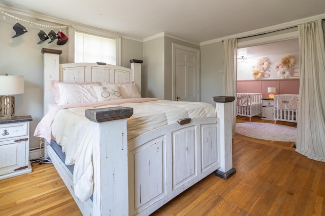 166 Franklin St, Bucksport, ME 04416 - bedroom featuring light wood finished floors and crown molding