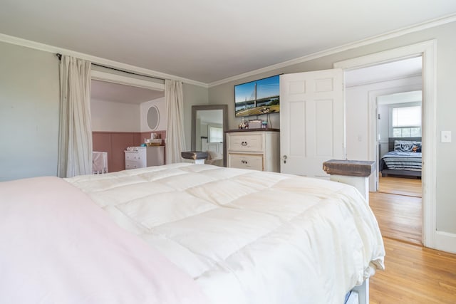 166 Franklin St, Bucksport, ME 04416 - bedroom with light wood-style floors and crown molding