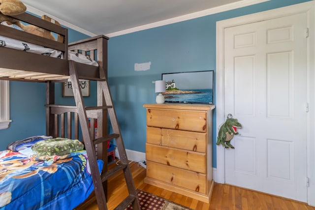 166 Franklin St, Bucksport, ME 04416 - bedroom featuring ornamental molding and wood finished floors