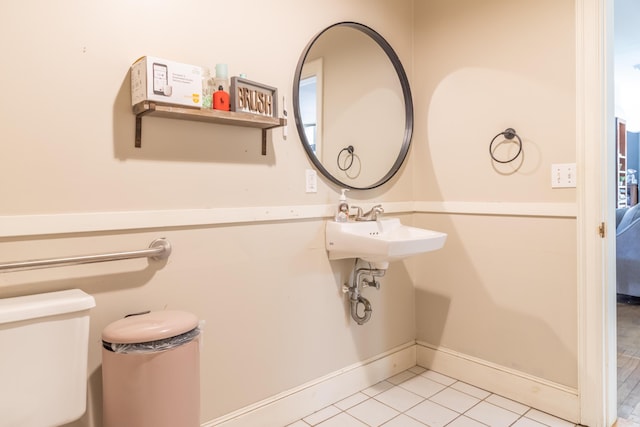 166 Franklin St, Bucksport, ME 04416 - half bath featuring toilet and tile patterned flooring
