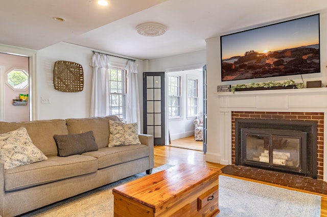 166 Franklin St, Bucksport, ME 04416 - living room featuring wood finished floors, a fireplace, and recessed lighting
