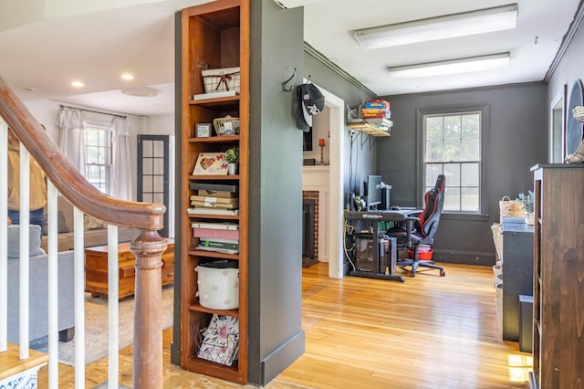 166 Franklin St, Bucksport, ME 04416 - office featuring wood finished floors, crown molding, a brick fireplace, and recessed lighting