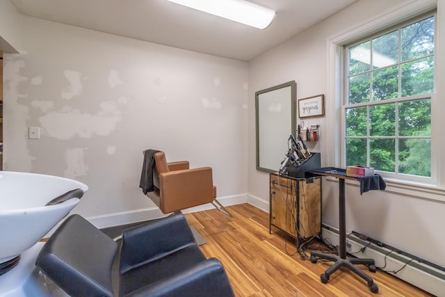 166 Franklin St, Bucksport, ME 04416 - office area with light wood finished floors and a baseboard heating unit
