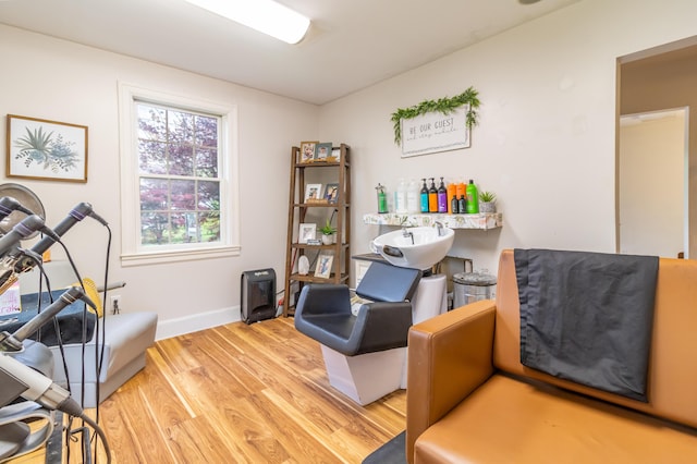 166 Franklin St, Bucksport, ME 04416 - sitting room with light wood finished floors and baseboards