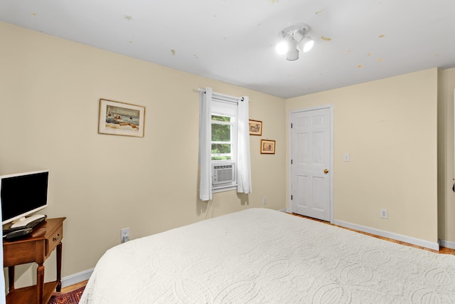 48 E Pasture Rd, Berwick, ME 03901 - bedroom featuring cooling unit, baseboards, and wood finished floors