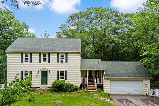 48 E Pasture Rd, Berwick, ME 03901 - colonial house featuring a porch, an attached garage, asphalt driveway, and a shingled roof