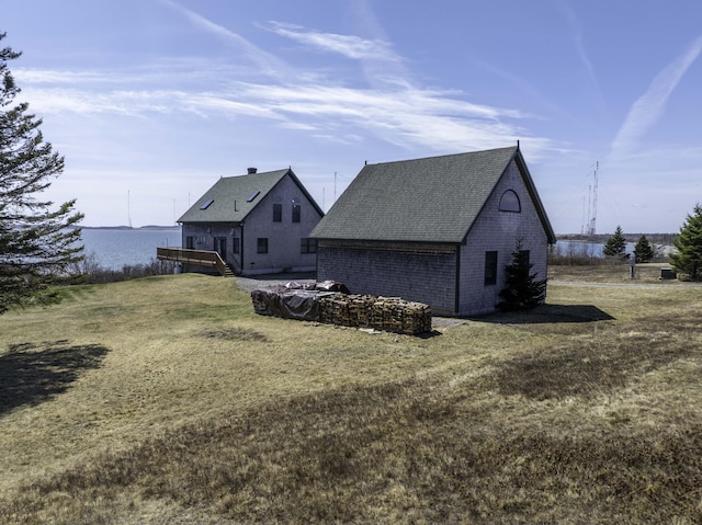 26 Ridge Rd, Cutler, ME 04626 - back of property featuring a yard, a wooden deck, and roof with shingles