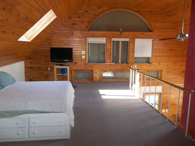 26 Ridge Rd, Cutler, ME 04626 - carpeted bedroom featuring wood ceiling, vaulted ceiling, wood walls, and a skylight