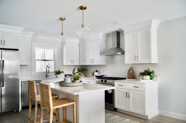 22 Salt Point Dr Unit 23, Old Orchard Beach, ME 04064 - kitchen with appliances with stainless steel finishes, wall chimney exhaust hood, wood finished floors, and light countertops