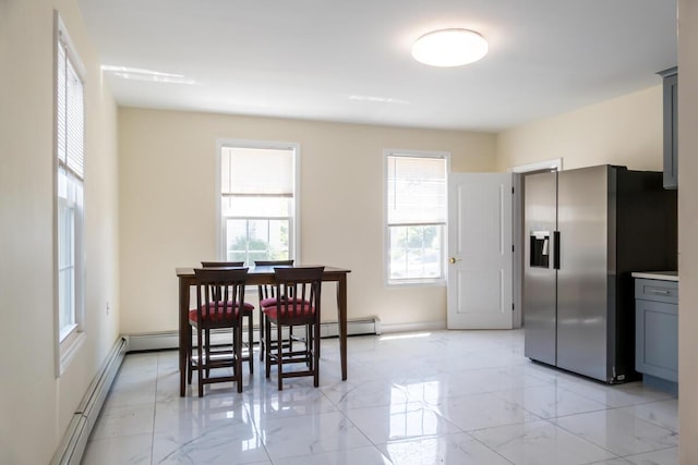 19 Mason St, Brunswick, ME 04011 - dining space with light marble finish flooring and a baseboard radiator
