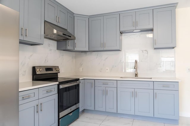 19 Mason St, Brunswick, ME 04011 - kitchen featuring appliances with stainless steel finishes, a sink, gray cabinets, and under cabinet range hood