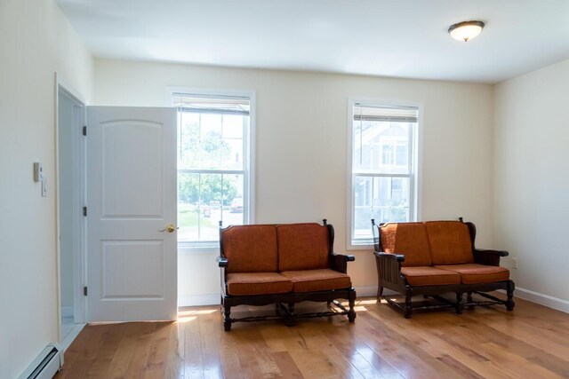 19 Mason St, Brunswick, ME 04011 - sitting room featuring baseboard heating and light wood-type flooring