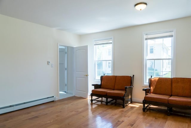 19 Mason St, Brunswick, ME 04011 - living area with a baseboard radiator and light wood-type flooring