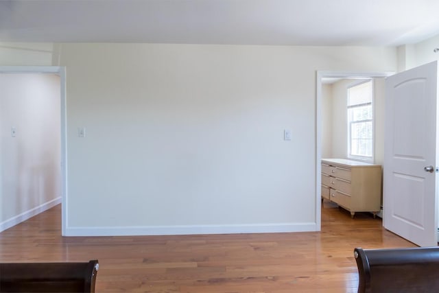 19 Mason St, Brunswick, ME 04011 - unfurnished room with baseboards and light wood-style floors