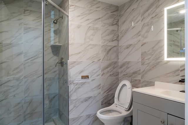 19 Mason St, Brunswick, ME 04011 - full bath featuring vanity, a shower stall, toilet, and tile walls