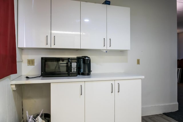 19 Mason St, Brunswick, ME 04011 - detailed view of black microwave and baseboards
