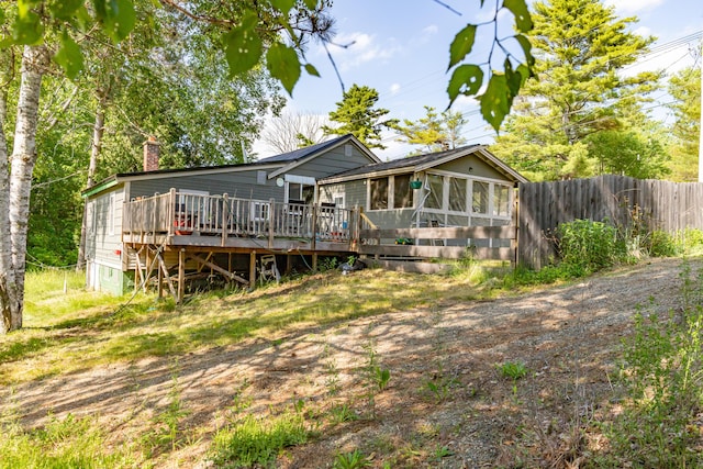 194 Main Rd, Passadumkeag, ME 04475 - view of front facade with a chimney, a deck, and a sunroom