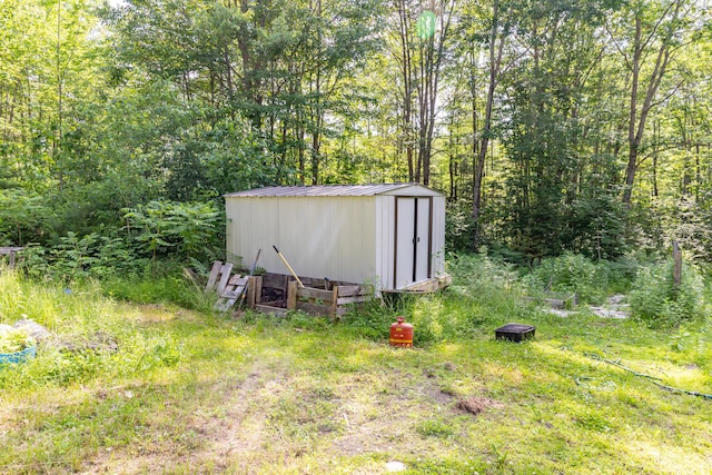 194 Main Rd, Passadumkeag, ME 04475 - view of shed featuring a wooded view