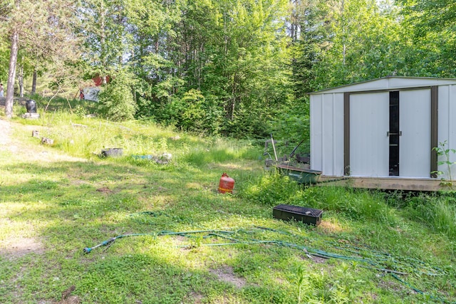 194 Main Rd, Passadumkeag, ME 04475 - view of yard featuring a storage unit