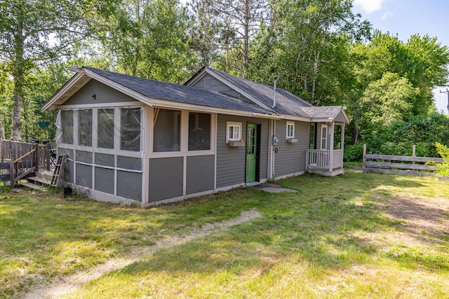 194 Main Rd, Passadumkeag, ME 04475 - rear view of house with a shingled roof and a sunroom